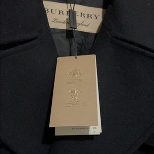 New with tags Inside front pockets. 70 % wool, Satin monogram lining.